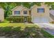 Charming two-story home with a two-car garage and a well-maintained, verdant front yard at 260 Redding Rdg, Atlanta, GA 30349