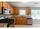 Well-equipped kitchen features stainless steel appliances, granite countertops and oak cabinetry at 260 Redding Rdg, Atlanta, GA 30349