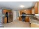 Traditional kitchen features stainless steel appliances, granite countertops and light wood cabinets at 260 Redding Rdg, Atlanta, GA 30349
