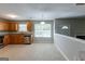 Spacious kitchen with wood cabinets, granite countertops and stainless steel appliances overlooks the dining area at 260 Redding Rdg, Atlanta, GA 30349