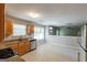 Bright kitchen with oak cabinets, stainless steel appliances, and granite countertops at 260 Redding Rdg, Atlanta, GA 30349