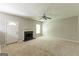 Cozy living room features a fireplace, a ceiling fan, a window, and an exterior door at 260 Redding Rdg, Atlanta, GA 30349