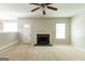 Bright living room features a fireplace, ceiling fan, and access to the backyard at 260 Redding Rdg, Atlanta, GA 30349