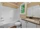Full bathroom with granite countertop, shower and tub combination, and stylish fixtures at 3355 Golfe Links Dr, Snellville, GA 30039
