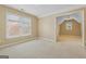 Bedroom featuring plush carpeting, natural lighting, and an attached bonus room at 3355 Golfe Links Dr, Snellville, GA 30039