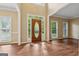 Bright foyer with soaring ceilings, wood floors, and a beautiful front door with glass panel at 3355 Golfe Links Dr, Snellville, GA 30039