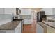 Well-equipped kitchen with granite countertops, white cabinets, and stainless steel appliances at 3355 Golfe Links Dr, Snellville, GA 30039