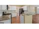 Well-equipped kitchen with granite countertops, white cabinets, and stainless steel appliances at 3355 Golfe Links Dr, Snellville, GA 30039