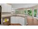 Well-equipped kitchen with granite countertops, white cabinets, and stainless steel appliances at 3355 Golfe Links Dr, Snellville, GA 30039