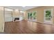 Bright living room with fireplace, built-ins, wood floors, and a large window view at 3355 Golfe Links Dr, Snellville, GA 30039