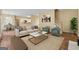 Spacious living room with cozy seating arrangement, plush rug, and easy access to the kitchen at 3355 Golfe Links Dr, Snellville, GA 30039