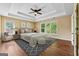 Tranquil main bedroom featuring tray ceiling, natural light, and serene color palette at 3355 Golfe Links Dr, Snellville, GA 30039