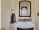 Bathroom featuring a vanity with framed mirror, faucet and towel rack at 2083 Hasel St, Lawrenceville, GA 30044
