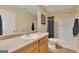 Bathroom featuring a single vanity, toilet, and a tub shower with shower curtain at 2083 Hasel St, Lawrenceville, GA 30044