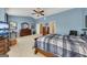 Inviting bedroom features light blue walls and carpet, complemented by well-coordinated wood furniture at 2083 Hasel St, Lawrenceville, GA 30044