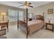 Comfortable bedroom featuring neutral paint, large windows, carpet, and wood furniture at 2083 Hasel St, Lawrenceville, GA 30044