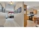 View of a hallway leading to the kitchen, with pictures on the wall at 2083 Hasel St, Lawrenceville, GA 30044