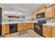 The kitchen area offers ample countertop space and black appliances, ideal for cooking at 2083 Hasel St, Lawrenceville, GA 30044