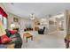 Open living room with a fireplace, neutral walls, and seamless flow to the kitchen at 2083 Hasel St, Lawrenceville, GA 30044