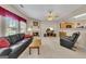 Living room features a fireplace, large windows, and adjacent eat-in kitchen at 2083 Hasel St, Lawrenceville, GA 30044
