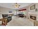 Bright living room with fireplace, windows, and access to the dining area at 2083 Hasel St, Lawrenceville, GA 30044