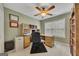 Bright office space featuring a large window, built-in shelving, and a functional desk setup at 2083 Hasel St, Lawrenceville, GA 30044