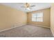 Bedroom with ceiling fan, neutral carpeting, window and a bright, airy feel at 2117 Chestnut Hill Circle Cir, Decatur, GA 30032