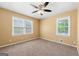 Bedroom with a ceiling fan, neutral carpeting and a window overlooking the yard at 2117 Chestnut Hill Circle Cir, Decatur, GA 30032