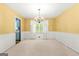 Bright dining room featuring white wainscoting, and a classic chandelier at 2117 Chestnut Hill Circle Cir, Decatur, GA 30032