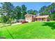 Split-level home on a green lot with an expansive lawn at 2117 Chestnut Hill Circle Cir, Decatur, GA 30032