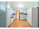 Bright kitchen with white appliances, light blue cabinets and modern tile backsplash at 2117 Chestnut Hill Circle Cir, Decatur, GA 30032