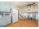 Charming kitchen with light blue cabinets, white appliances, and views of the living spaces at 2117 Chestnut Hill Circle Cir, Decatur, GA 30032