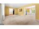 Large living room with carpet, light-filled space, and access to other rooms at 2117 Chestnut Hill Circle Cir, Decatur, GA 30032
