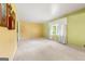Spacious living room with large window, carpeted floors and light-filled space at 2117 Chestnut Hill Circle Cir, Decatur, GA 30032