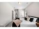 Bright bedroom featuring a full size bed, bedside table, and ample closet space at 234 Retreat Ln, Canton, GA 30114