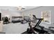 Bonus room with multiple beds, exercise equipment, and natural light from two windows at 234 Retreat Ln, Canton, GA 30114