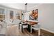 Cozy dining room with wood floors, modern light fixture, and access to the outdoor deck at 234 Retreat Ln, Canton, GA 30114