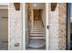 Inviting entryway with brick accents, and staircase leading to the upper levels at 234 Retreat Ln, Canton, GA 30114