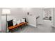 Cozy hallway landing with a bench, pillows, and a glimpse into a well-lit sitting area at 234 Retreat Ln, Canton, GA 30114