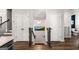 Hallway featuring wooden floors, stairway, and access to a bathroom at 234 Retreat Ln, Canton, GA 30114