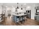Bright kitchen with white cabinetry, stainless steel appliances, and barstool seating at the island at 234 Retreat Ln, Canton, GA 30114