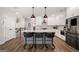 Modern kitchen featuring stainless steel appliances, a large island, and barstool seating at 234 Retreat Ln, Canton, GA 30114