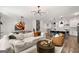Spacious living room with hardwood floors, modern lighting, and open floor plan to the kitchen at 234 Retreat Ln, Canton, GA 30114