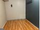 A view of the basement with wood-look flooring and painted paneling at 6332 Valley Dale Dr, Riverdale, GA 30274