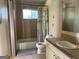 Bathroom featuring a tiled shower-tub combination, toilet, and vanity with sink at 6332 Valley Dale Dr, Riverdale, GA 30274
