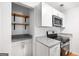 Well-equipped kitchen boasts stainless steel appliances, granite countertops, and contemporary cabinetry at 191 High Creek Dr, Roswell, GA 30076