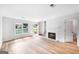 Bright living room boasts large windows, a cozy fireplace, and plenty of space for entertaining at 191 High Creek Dr, Roswell, GA 30076