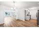 Open-concept living area flows seamlessly into the kitchen with gorgeous floors throughout at 191 High Creek Dr, Roswell, GA 30076