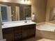 Bathroom featuring double vanity, tub and separate shower at 2084 Cobblestone Ne Cir, Brookhaven, GA 30319