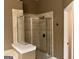 Bathroom featuring glass enclosed shower with tile surround at 2084 Cobblestone Ne Cir, Brookhaven, GA 30319